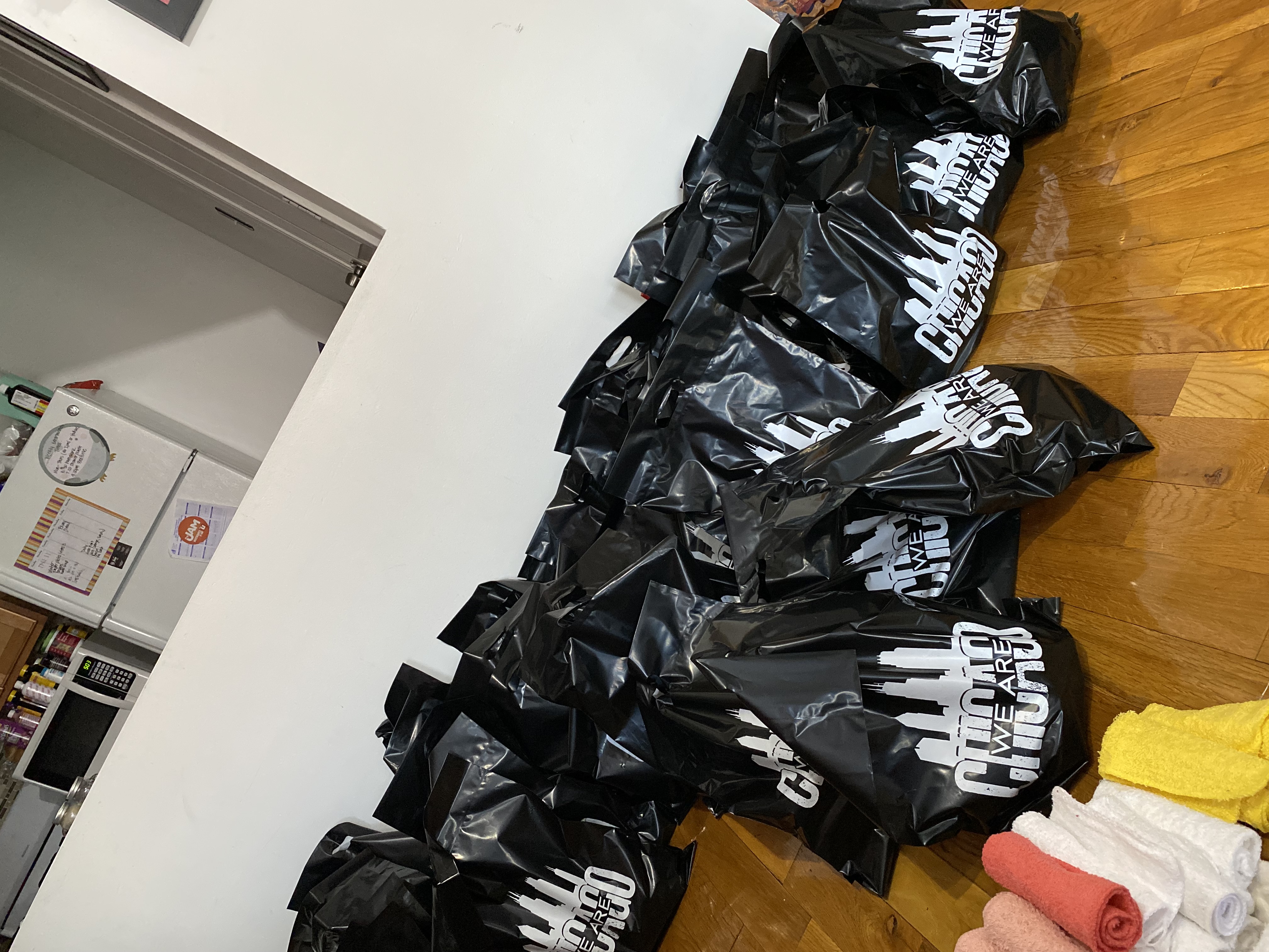 Dozens of packed care bags with hygiene supplies and towels ready for distribution